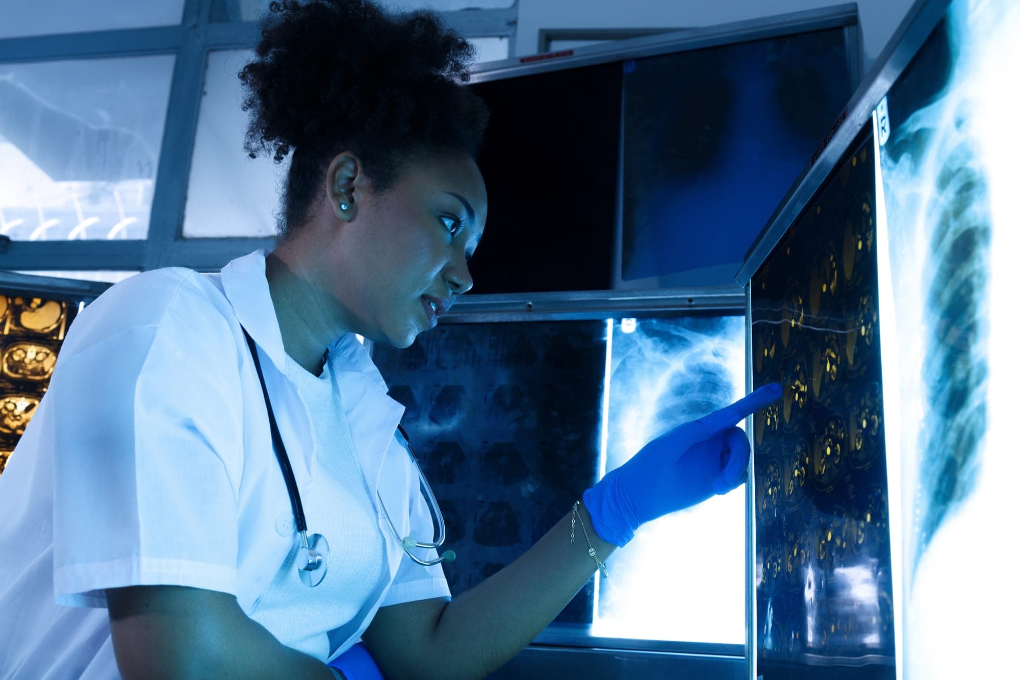 A clinician reviewing diagnostic imaging
