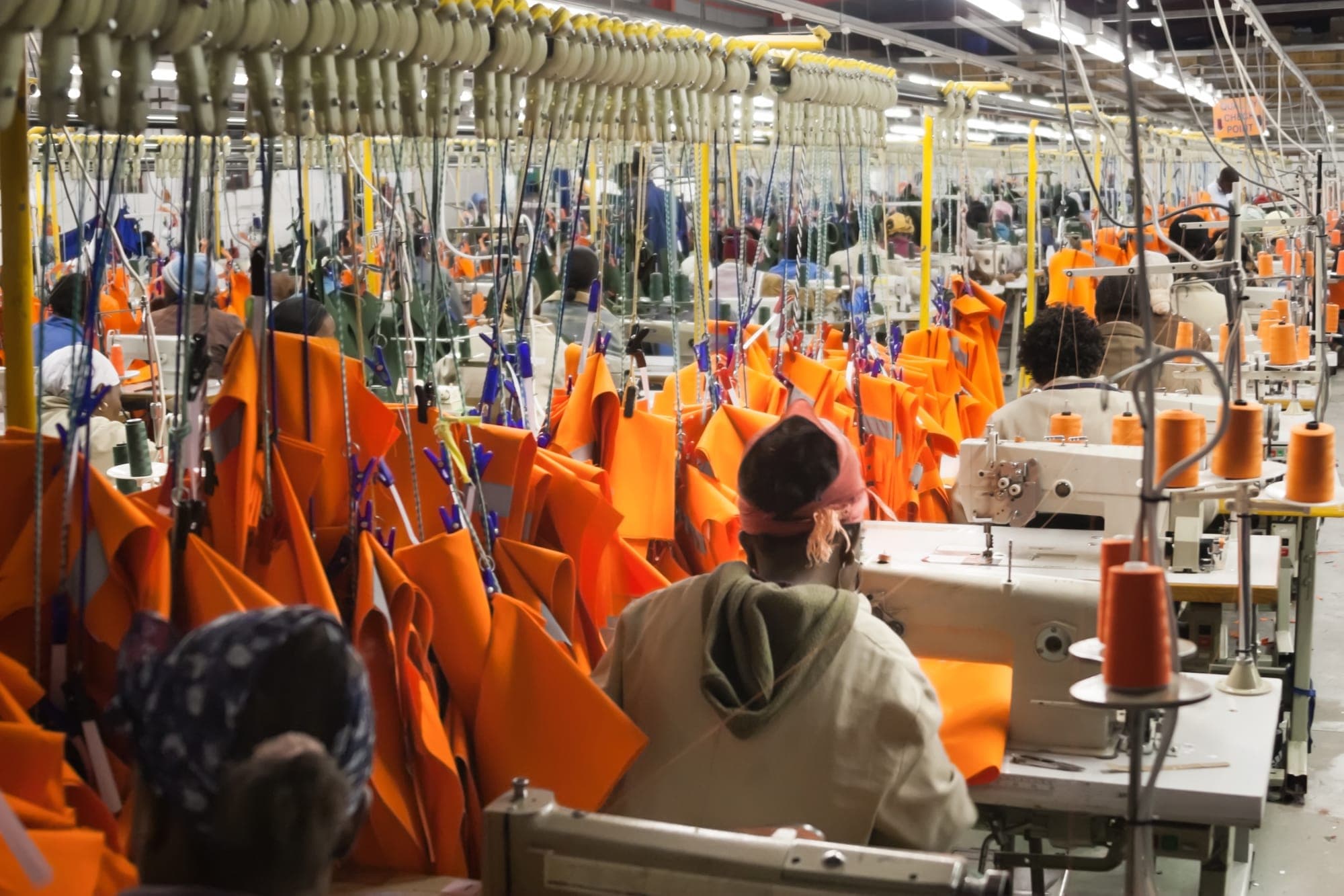 Workers on the floor of a garment manufacturing enterprise